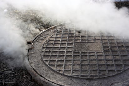 Sewer gas escaping manhole