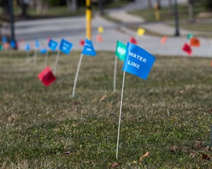 Utility locating flags with markers